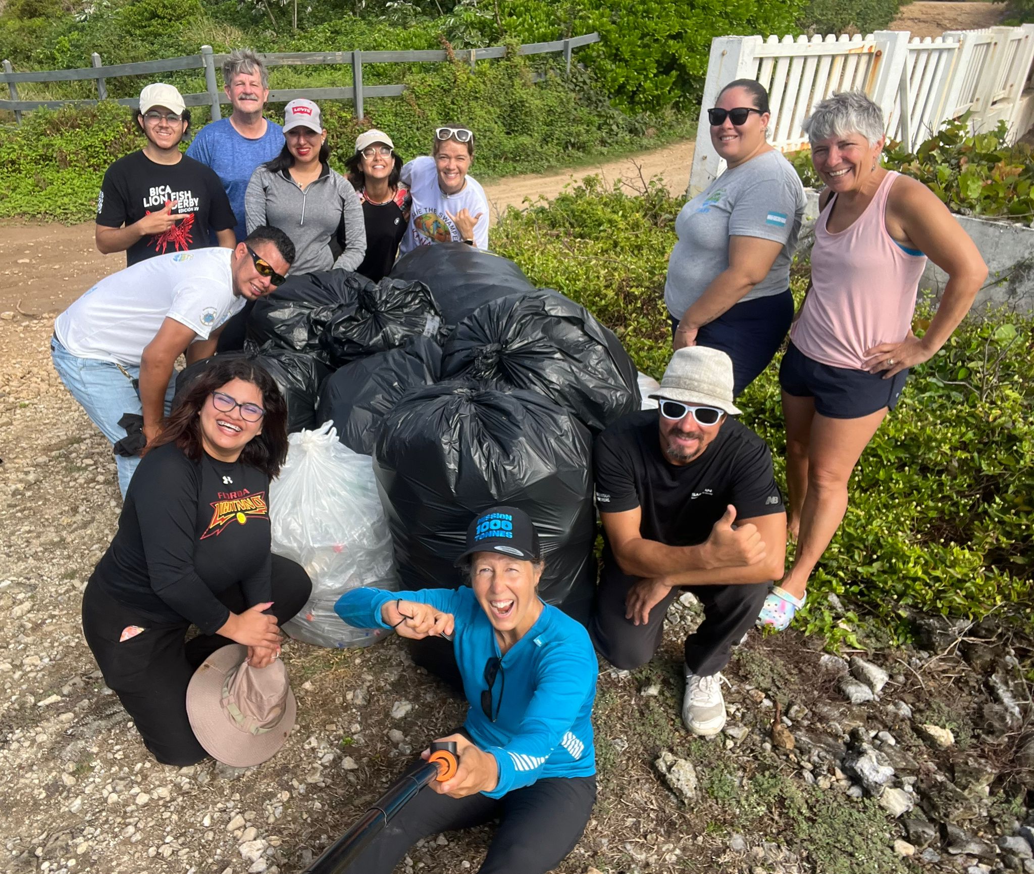 Cheerful cleanup volunteers take a selfie at Casa Love on March 4th 2026.